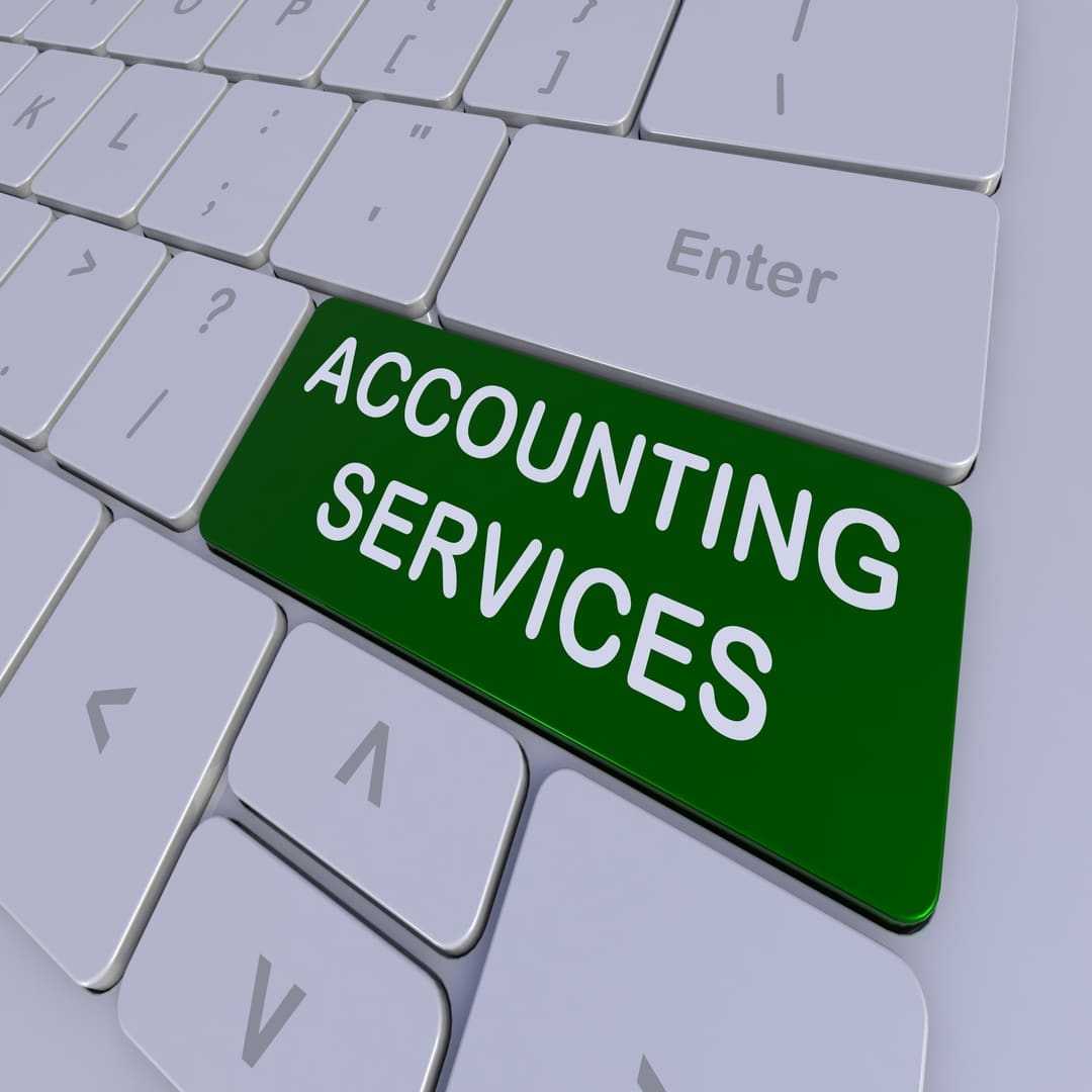 Image of a keyboard with 'ACCOUNTING SERVICES' on a green button on the keyboard under the enter button.
